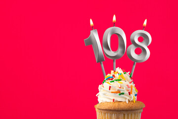 Horizontal birthday card with cake - Burning candle number 108