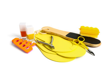 Set of professional tools for pedicure with nail polishes isolated on white background