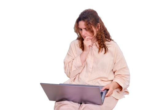 Sad woman student reflected while sitting on the bed with a computer, isolated on a white background. Doubting woman while studying online from home
