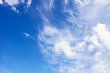 Blue sky with clouds background.