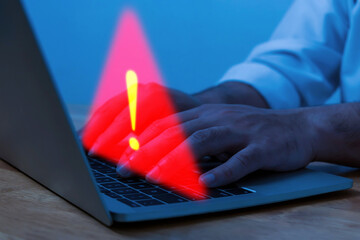 Antivirus. business people hand using laptop computer with virtual malware attack warning graphic...
