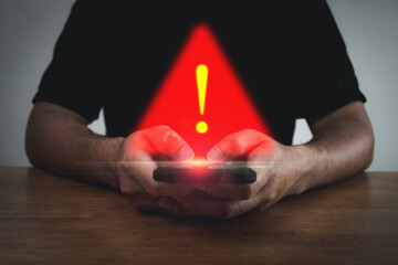 Obraz na płótnie Canvas Antivirus. people hand using mobile smart phone with virtual malware attack warning graphic icon on desk, virus protection software, cyber, business finance, internet network technology concept