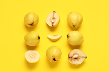 Sweet ripe quinces on yellow background