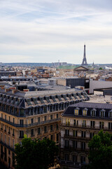 Paris cityscape. Rooftops of the buildings, Eiffel Tower in the background