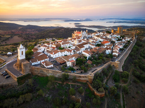 Aerial view of Monsaraz a tiny charming village inside castle walls in Alentejo region of Portugal, at sunrise