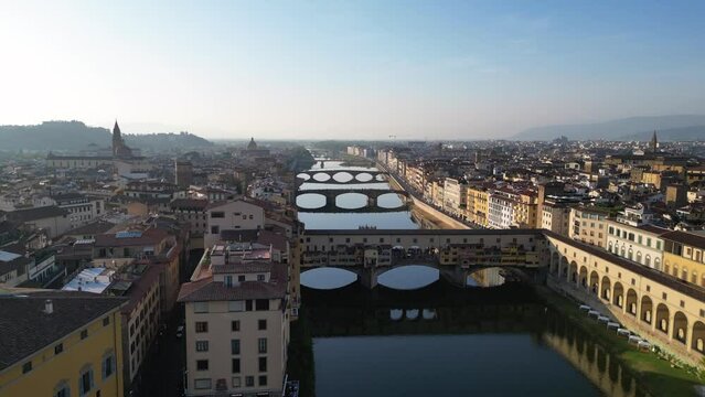 Dramatic aerial top view flight drone medieval Bridges Arno River Florence Italy