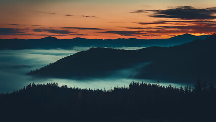 Sunrise sea of fog moving over mountain range, alps mountain silhouette with pine tree forest...