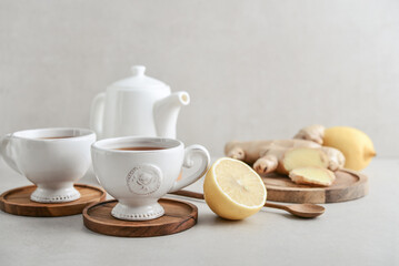 Ginger tea with lemon in a white cups
