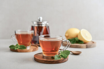 Tea  in a glass cups with lemon on cutting board