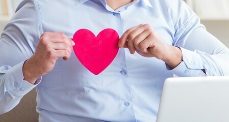 Young man making marriage proposal over internet laptop