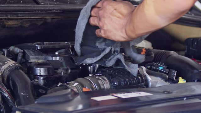 Cleaning Car Engine In Repair Shop In Slow Motion Footage.