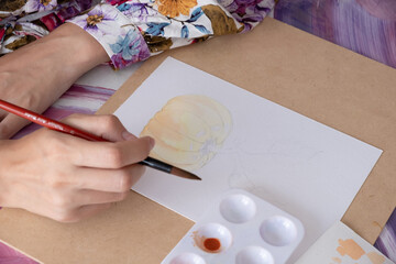Watercolors master class. A hand drawing pumpkin