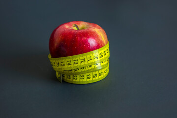 Apple and measuring tape