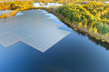 Floating Solar panels in large water pond for generating electricity from sunlight