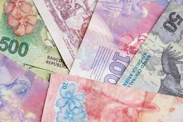 close-up of Argentine banknotes of different denominations - obrazy, fototapety, plakaty