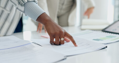 Hand, documents or planning with a business person reading information in the office closeup for...