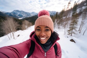 Fototapeta na wymiar Social Media influencer Young hiker woman taking selfie video portrait on the top of mountain