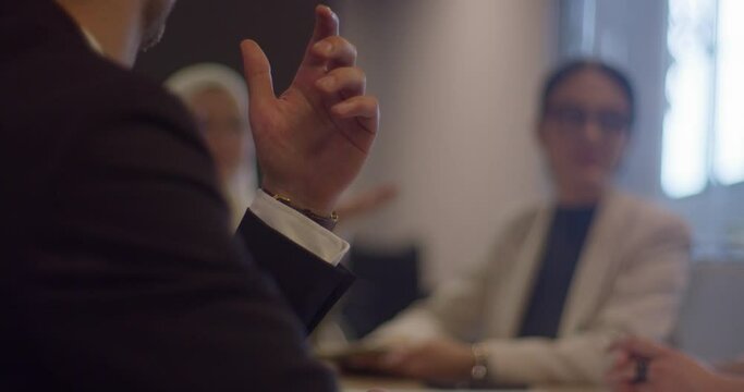 A diverse group of entrepreneurs engages in a dynamic business meeting within a modern office, showcasing their collaborative spirit and innovative approach to business development