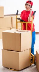 Young female professional mover doing home relocation