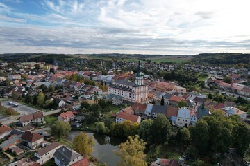 Fototapeta premium Polna historical city center of Bohemian town with square,column and cathedral and Polna castle,aerial panorama landscape view,Czech republic,Europe