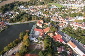 Fototapeta premium Polna historical city center of Bohemian town with square,column and cathedral and Polna castle,aerial panorama landscape view,Czech republic,Europe