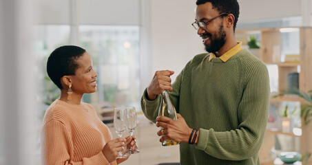 African couple, glasses and champagne in home with smile, celebration and party for success in...