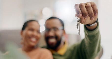 Hand, keys and couple with closeup in new home for fresh start, property or real estate investment...