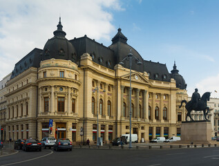 Obraz premium Central University Library of Bucharest and monument Carol I, Romania