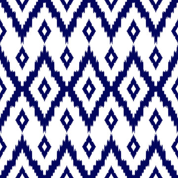 Dark navy blue and white geometric ethnic ikat pattern. Vector seamless fabric pattern design for cross stitch, clothing, embroidery, wallpaper, knitting, quilt.