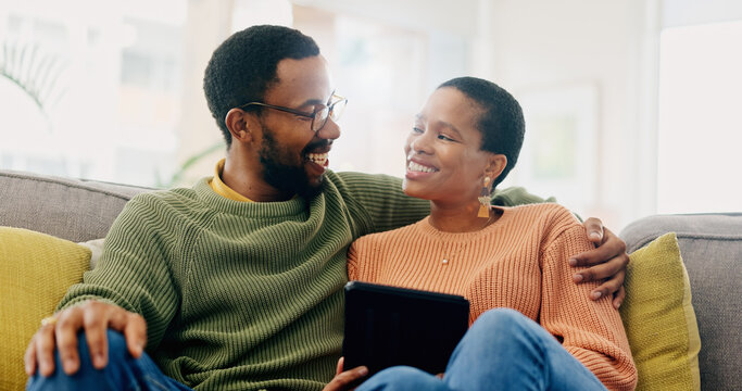 Hug, home tablet and black couple happy for social media post, morning wellness blog or relationship romance. Living room sofa, eye contact and African man, woman or marriage people embrace for love