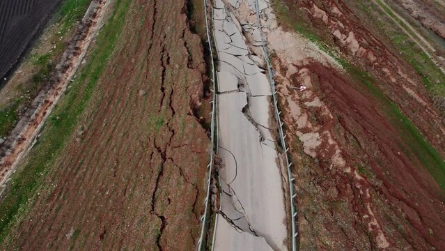 Heavy damage in the earthquakes, some roads became completely unusable. It collapsed due to fragmentation and cracks in the connecting roads.Close-up of ruined road or street with parts of asphalt.
