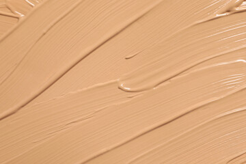Texture of skin foundation as background, closeup