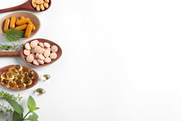 Different pills and herbs on white background, flat lay with space for text. Dietary supplements