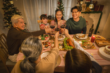 Fototapeta na wymiar happiness Asian family with multi generation together on thanksgiving and Christmas celebration traditional dinner at home