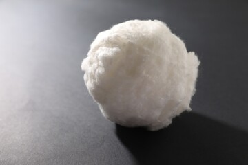 Ball of clean cotton wool on grey background, closeup