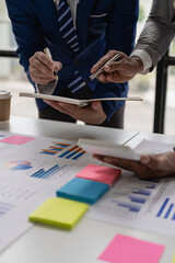 Vertical image of business financial analyst on investment project planning during discussion in...