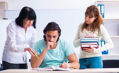 Old teacher and students in the classroom