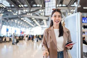 Portrait of Asian young girl walk in airport terminal to boarding gate. 