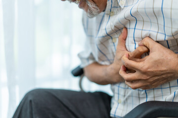 Asian senior older man having chest pain feel suffer from heart attack. 