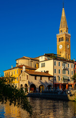 Fototapeta na wymiar Cityscape of old historical buildings and Lemene river in Portogruaro, Venezia, Veneto, Italy