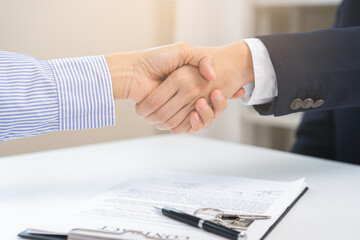 Sell agent, success deal asian young woman handshake or shaking hands with landlord realtor, client male after buyer man signed rental, lease contract. Banker agreement mortgage loan, property lease.