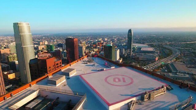 Aerial Panning Shot Of Vehicles On Roads Near Modern Buildings In City Against Sky - Los Angeles, California