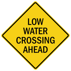 Flood danger sign and labels low water crossing ahead