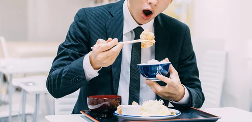 Tuinposter 定食を食べる日本人男性ビジネスマン © Trickster*
