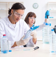 Two chemists working in the lab