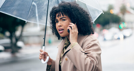Businesswoman, worry and phone for talking in city for commute to work by walking with umbrella for...