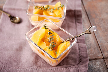 Traditional Italian dessert panna cotta with peaches, close up