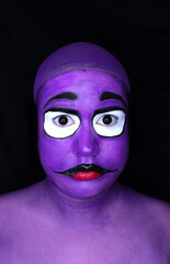 A woman dressed up as a purple monster 