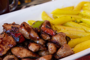 Pasta with chicken and tomato and mushrooms. Traditional italian food.