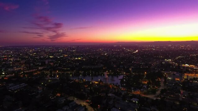 Aerial Time Lapse Shot Of Echo Park Lake Amidst Buildings In City Against Sky At Dusk - Los Angeles, California